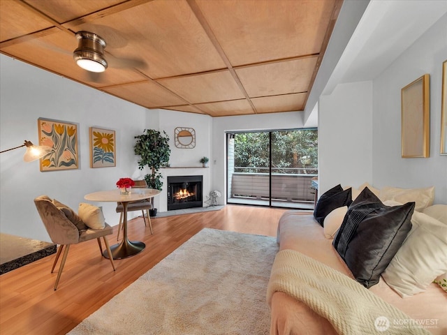 211 Summit Ave E Unit N308, Seattle, WA 98102 - living area featuring wood finished floors and a warm lit fireplace