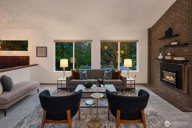 carpeted living room featuring a fireplace, a textured ceiling, and vaulted ceiling