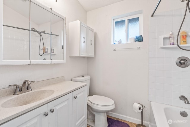 full bathroom with tiled shower / bath combo, vanity, and toilet