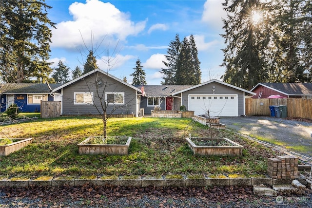 ranch-style home with a garage and a front yard