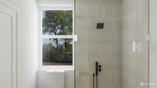 bathroom with a tile shower