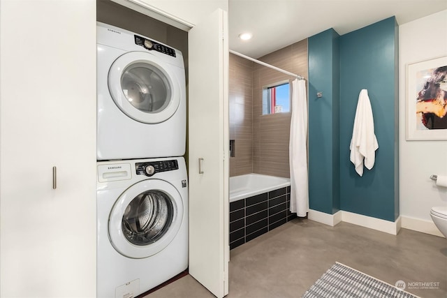 laundry room with stacked washer and dryer