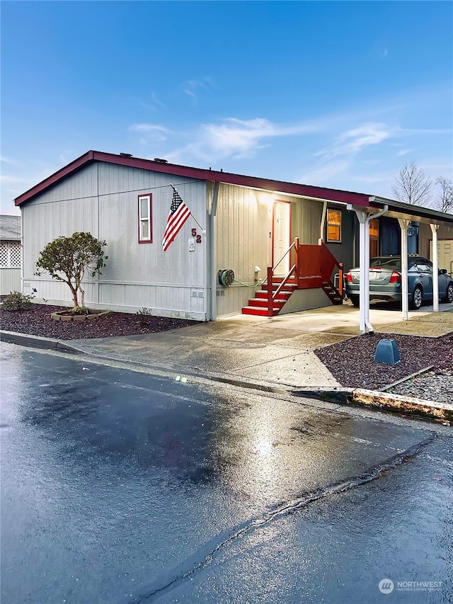 manufactured / mobile home featuring a carport