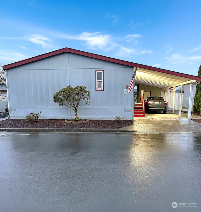 view of property exterior featuring a carport