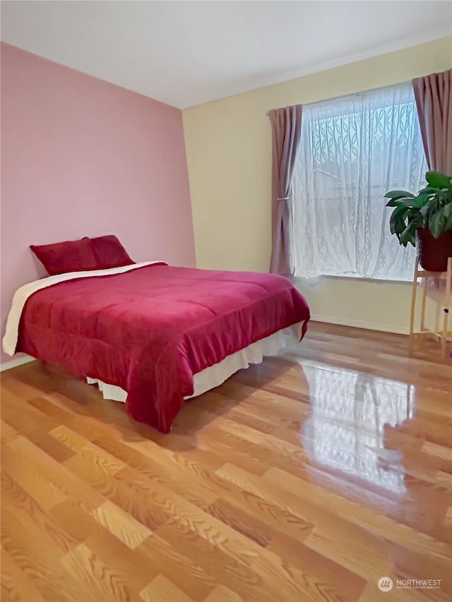 bedroom featuring wood-type flooring