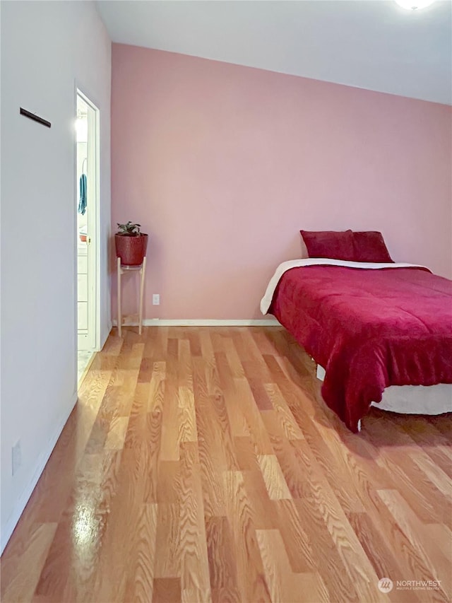 bedroom with light wood-type flooring