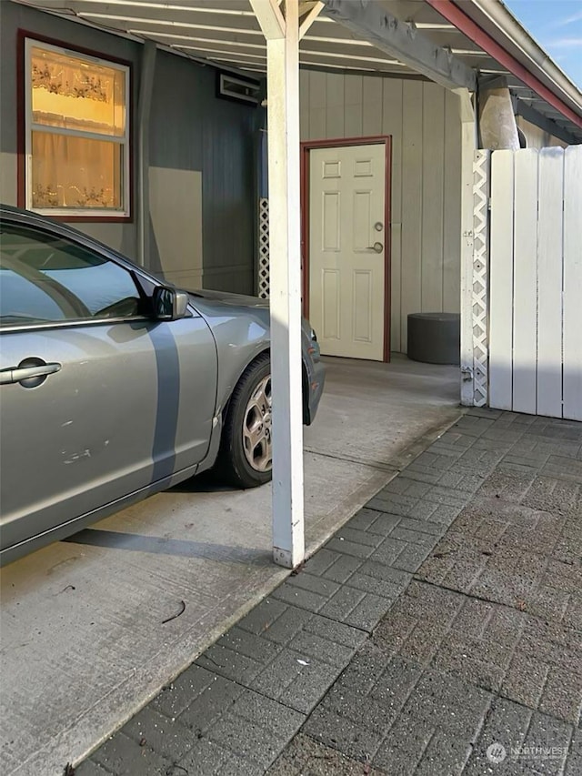 garage featuring a carport