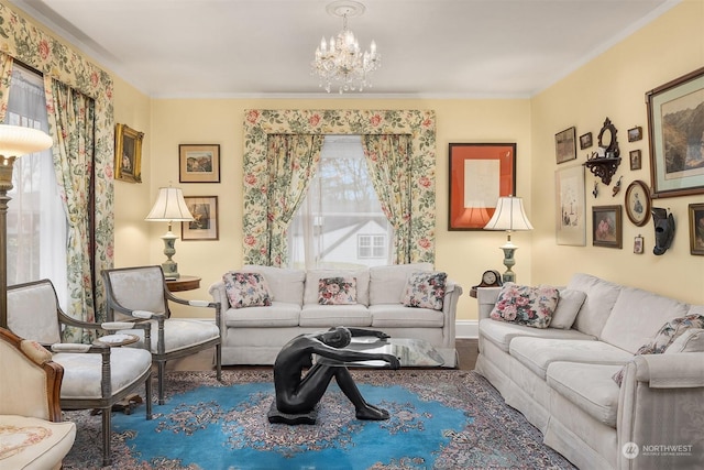 living room with crown molding and a chandelier