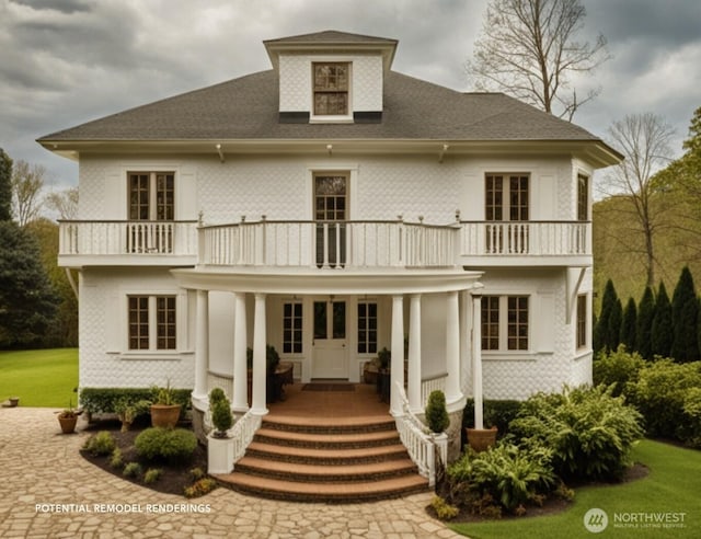 1021 34th Ave E, Seattle, WA 98112 - back of house with a balcony, covered porch, and a shingled roof