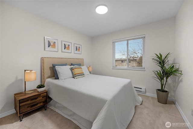 bedroom featuring a baseboard radiator, light carpet, and baseboards