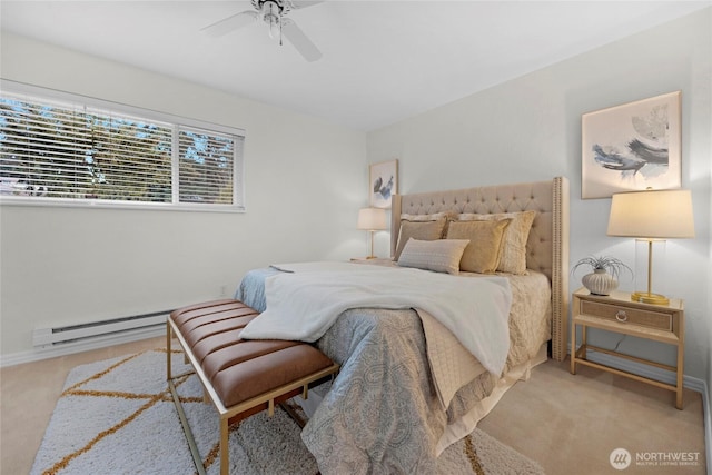 bedroom with a baseboard heating unit, light carpet, and a ceiling fan