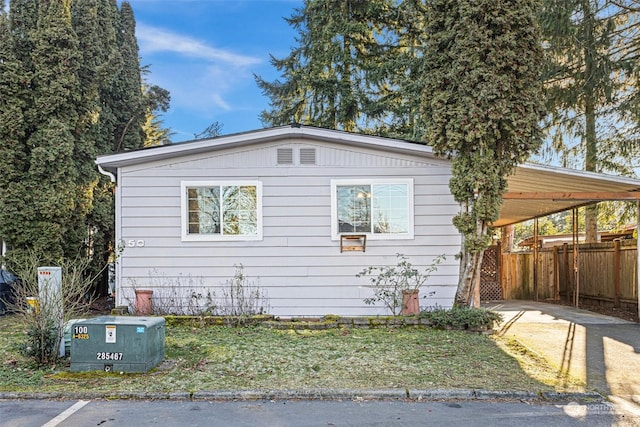 view of home's exterior featuring a carport