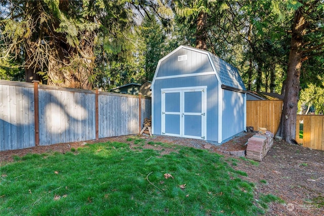 view of outbuilding with a lawn