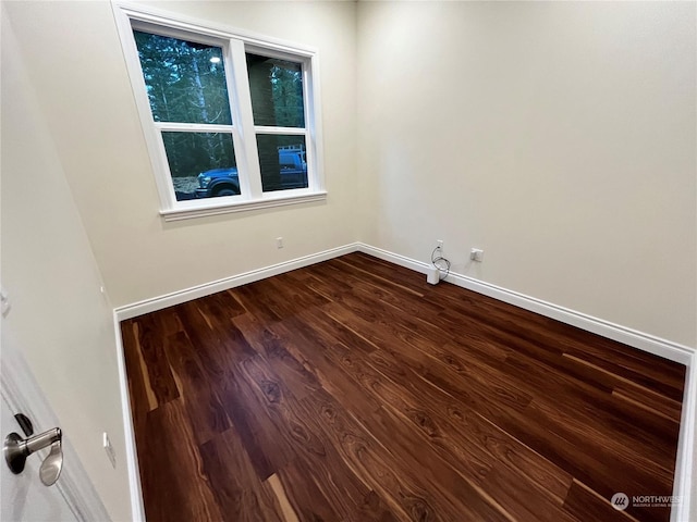 unfurnished room with hardwood / wood-style flooring