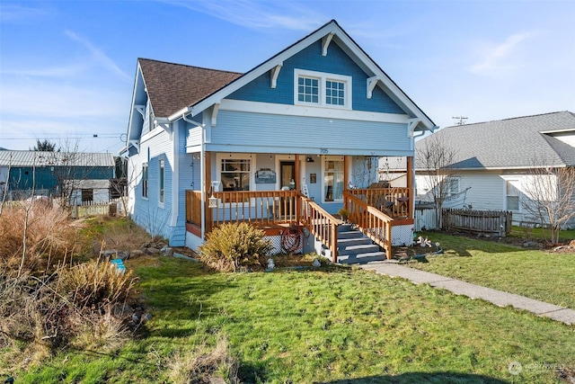 bungalow-style house with a front lawn and a porch