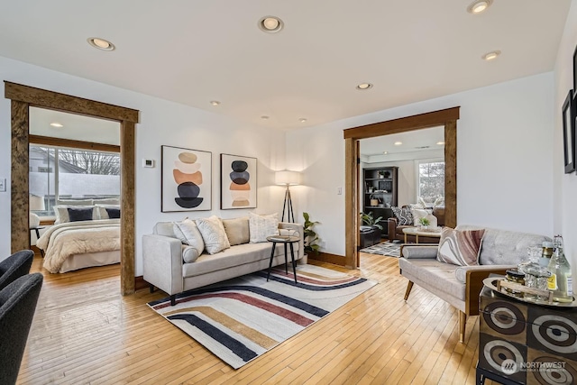 living room with plenty of natural light and light hardwood / wood-style floors