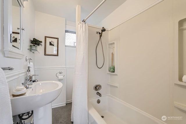 bathroom featuring sink and shower / bath combo with shower curtain