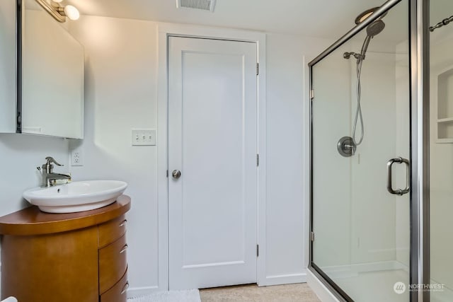 bathroom with vanity and walk in shower