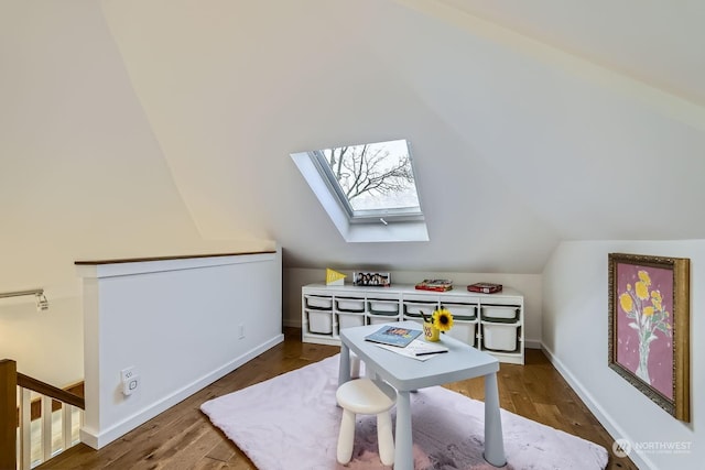 office area featuring dark wood-type flooring and lofted ceiling with skylight