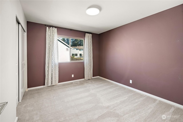 spare room with light carpet