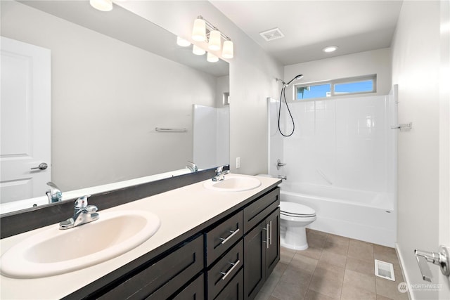 full bathroom with shower / bath combination, vanity, toilet, and tile patterned floors