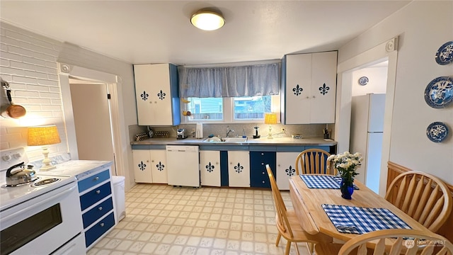 kitchen with white cabinetry, white appliances, and decorative backsplash