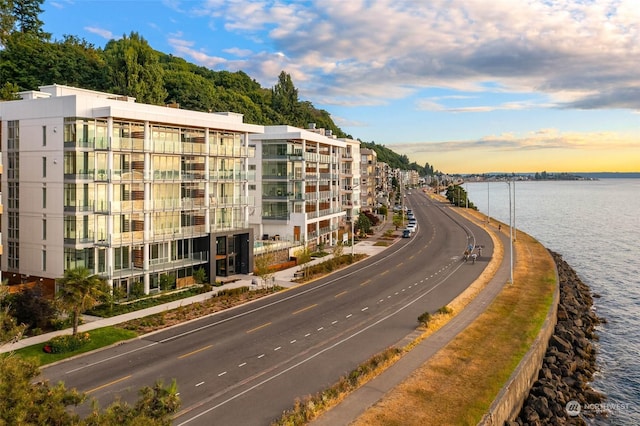 outdoor building at dusk featuring a water view