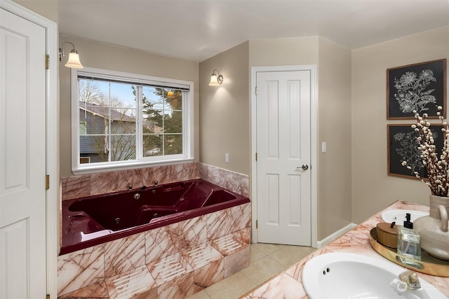 bathroom with a whirlpool tub, double vanity, tile patterned flooring, and a sink