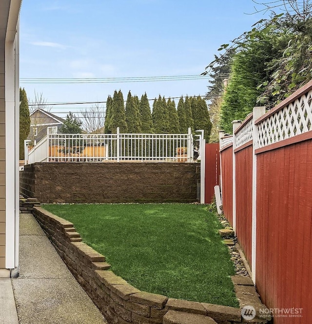 view of yard with a fenced backyard