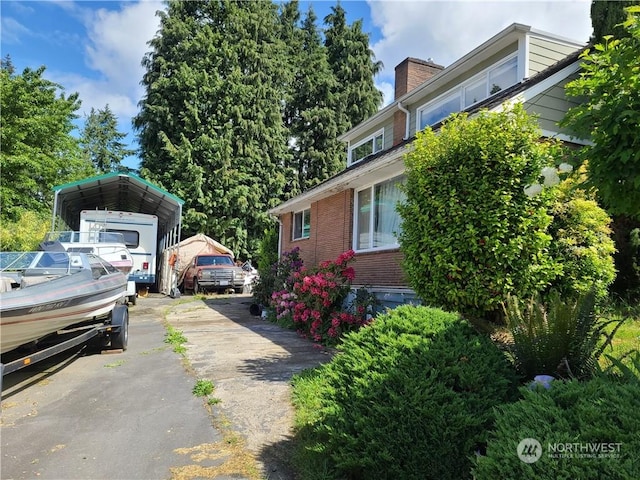 view of side of home featuring a carport