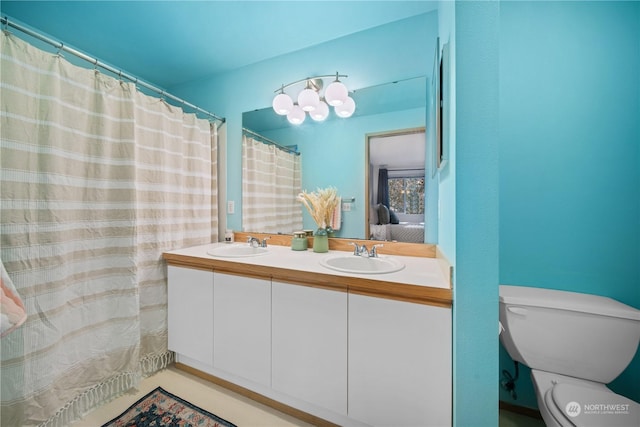 bathroom featuring vanity and toilet