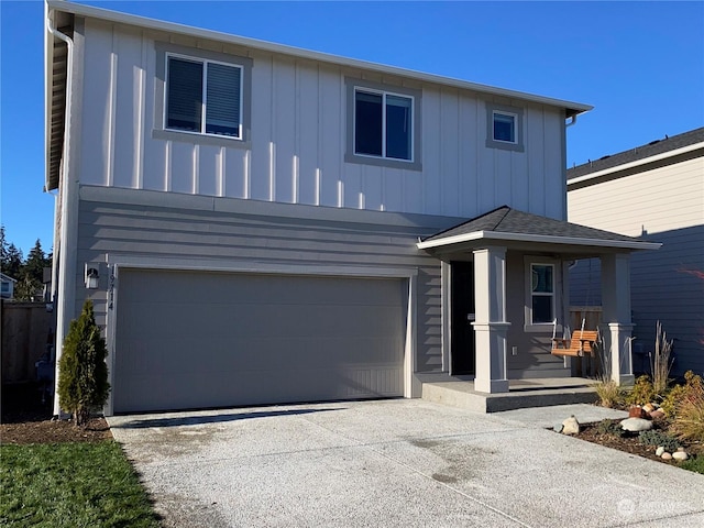 view of front property featuring a garage and covered porch