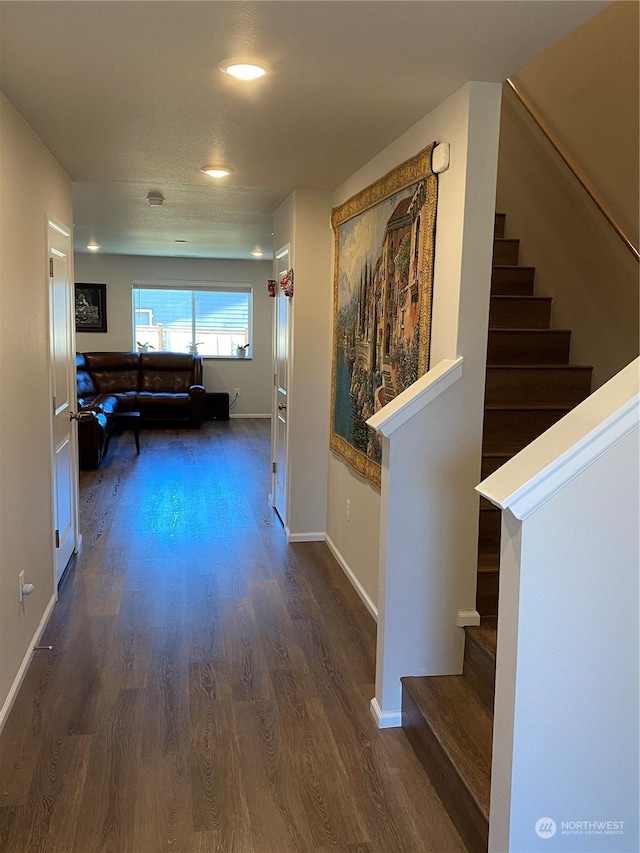 corridor featuring dark hardwood / wood-style flooring