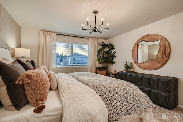 bedroom with a notable chandelier and carpet flooring