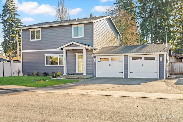 view of front property with a garage and a front yard