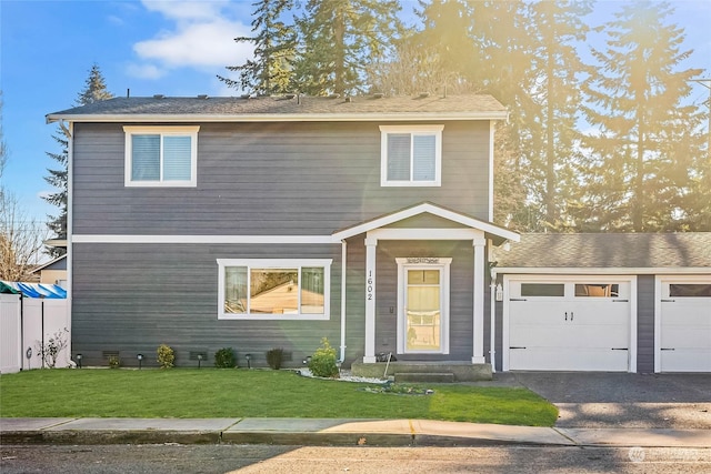 view of front of house featuring a garage and a front yard