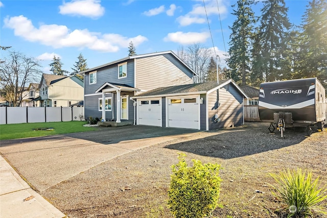 view of front of house with a garage and a front lawn