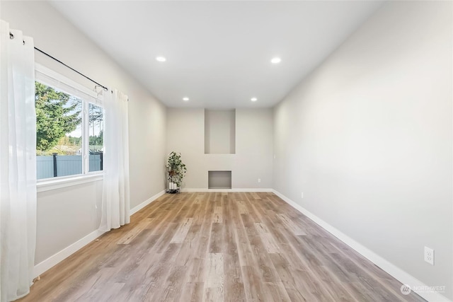 unfurnished living room with light hardwood / wood-style flooring