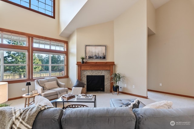 living room featuring light colored carpet, a fireplace, and high vaulted ceiling