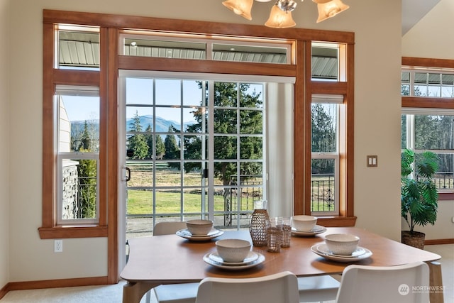 interior space featuring a chandelier and a mountain view