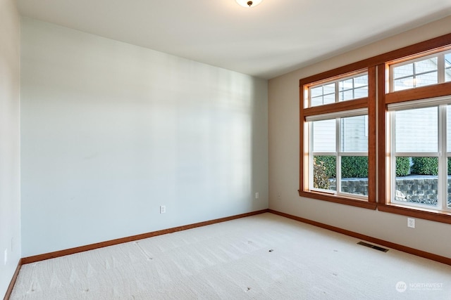 unfurnished room with light colored carpet