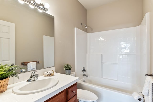 full bathroom featuring vanity, shower / bathing tub combination, and toilet