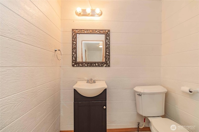 bathroom featuring toilet and vanity