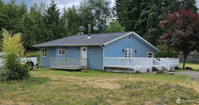 14241 State Route 507 SE, Yelm, WA 98597 - view of front of property featuring a front yard, a wooden deck, and a shingled roof