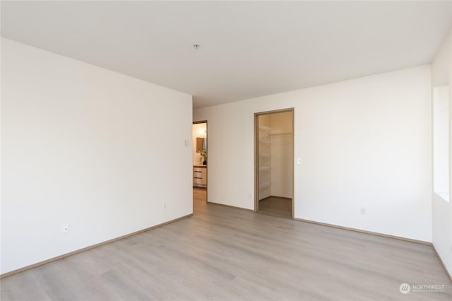 spare room with light wood-type flooring