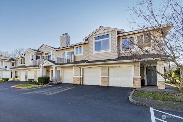 multi unit property featuring a garage