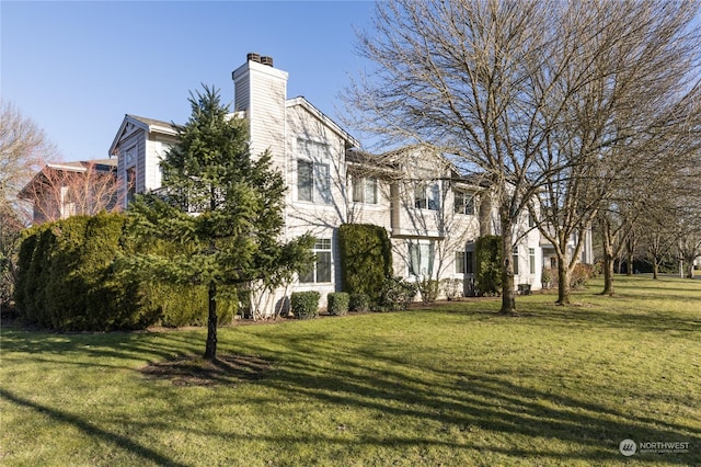 view of home's exterior featuring a yard