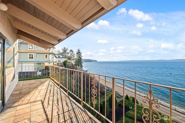 balcony with a view of the beach and a water view