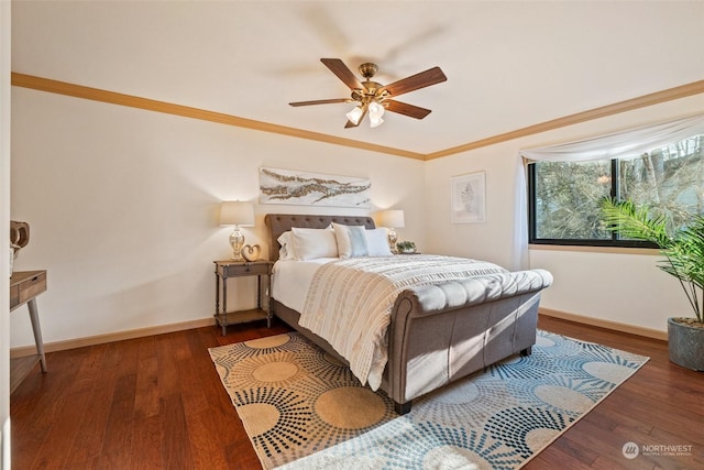 bedroom with dark hardwood / wood-style flooring, crown molding, and ceiling fan