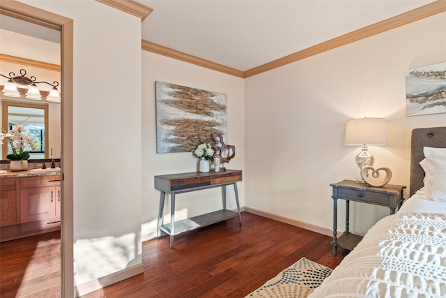 bedroom with dark wood-type flooring, connected bathroom, crown molding, and sink